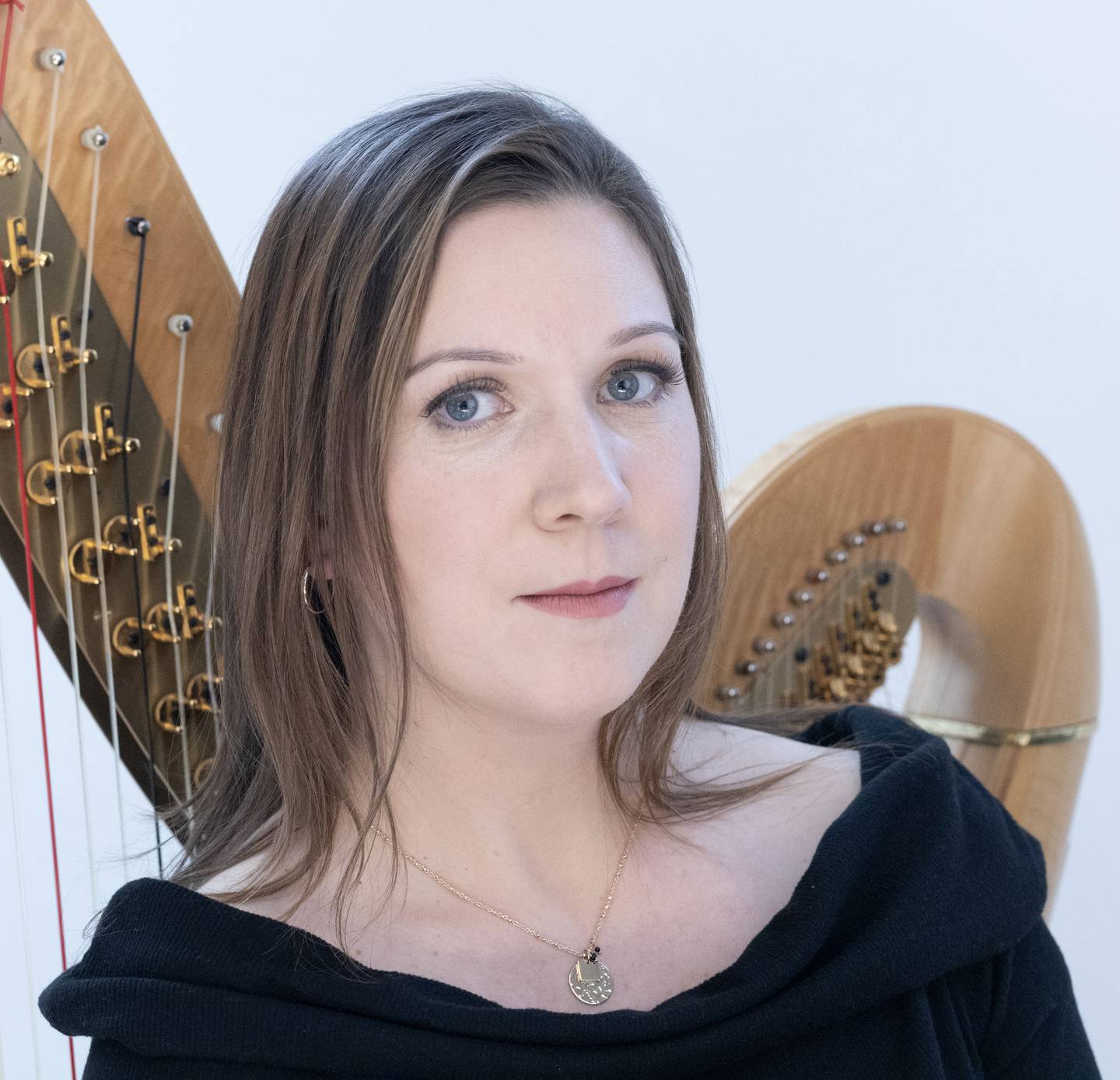 Harpist Erin Freund will appear with the St. Charles Singers.