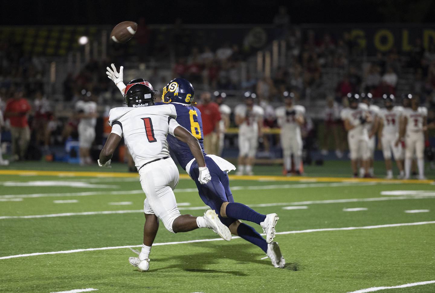 Sterling’s Jimmy Wadsworth dives but comes up short on catch against Metamora’s Jaiduan Cranford Friday, Aug. 30, 2024 at Sterling High School.