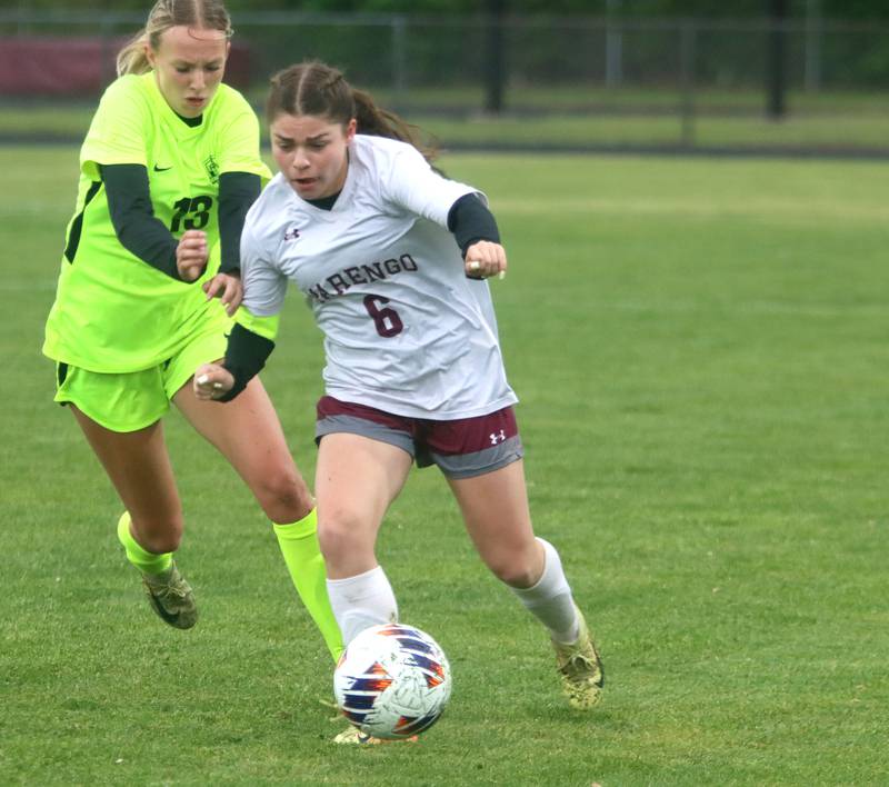 Marengo’s Katie Polizzi, right, gets past Richmond-Burton’s Sydney Frericks in IHSA Class 1A Regional Title Game action soccer at Marengo High School in Marengo on Wednesday, May 21, 2025.