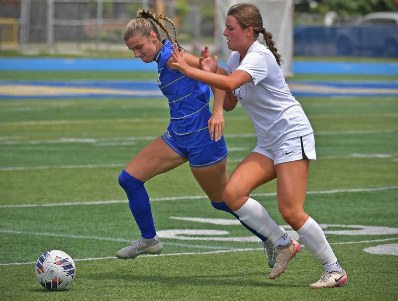 Lyons Township’s Lauren Salvino and Downers Grove North’s Olivia Watland (right) tangle for the ball during their Class 3A Lyons Regional final on May 23, 2026 at Lyons Township High School in LaGrange.