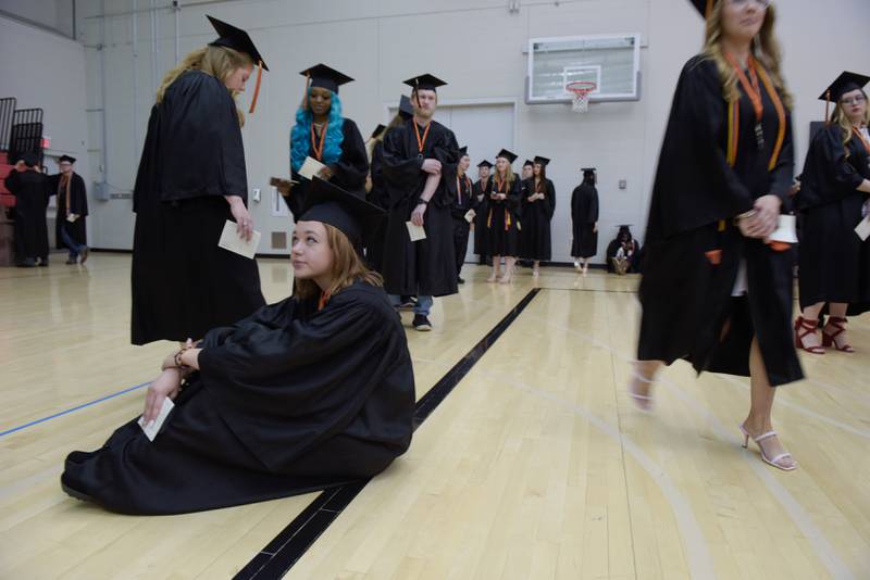 Kaitlin Haley relaxes while waiting for the DeKalb High School graduation ceremony start at the Convocation Center in DeKalb on Saturday, May 28, 2022.