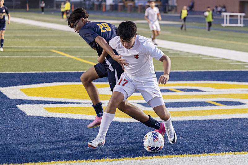Sterling’s Kevin Ruiz (left) and Lasalle-Peru’s Ismael Mejia fight for the ball Tuesday, Oct. 17, 2023 in a regional semifinal in Sterling.