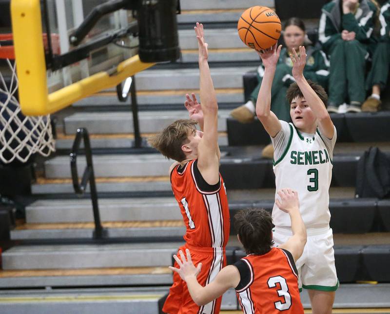 Seneca's James Zydron shoots a jump shot over Roanoke-Benson's Evan Reifsteck during the Tri-County Conference Tournament on Tuesday, Jan. 27, 2026 at Putnam County High Schooo.