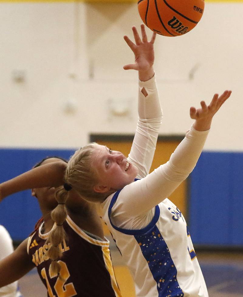 \Johnsburg's Casie Majercik tries to grab a rebound in front of Chicago Marshall's Janiyah Green during a IHSA Class 2A Johnsburg Sectional girls basketball semifinal game on Tuesday, February, 24, 2026, at Johnsburg High School.