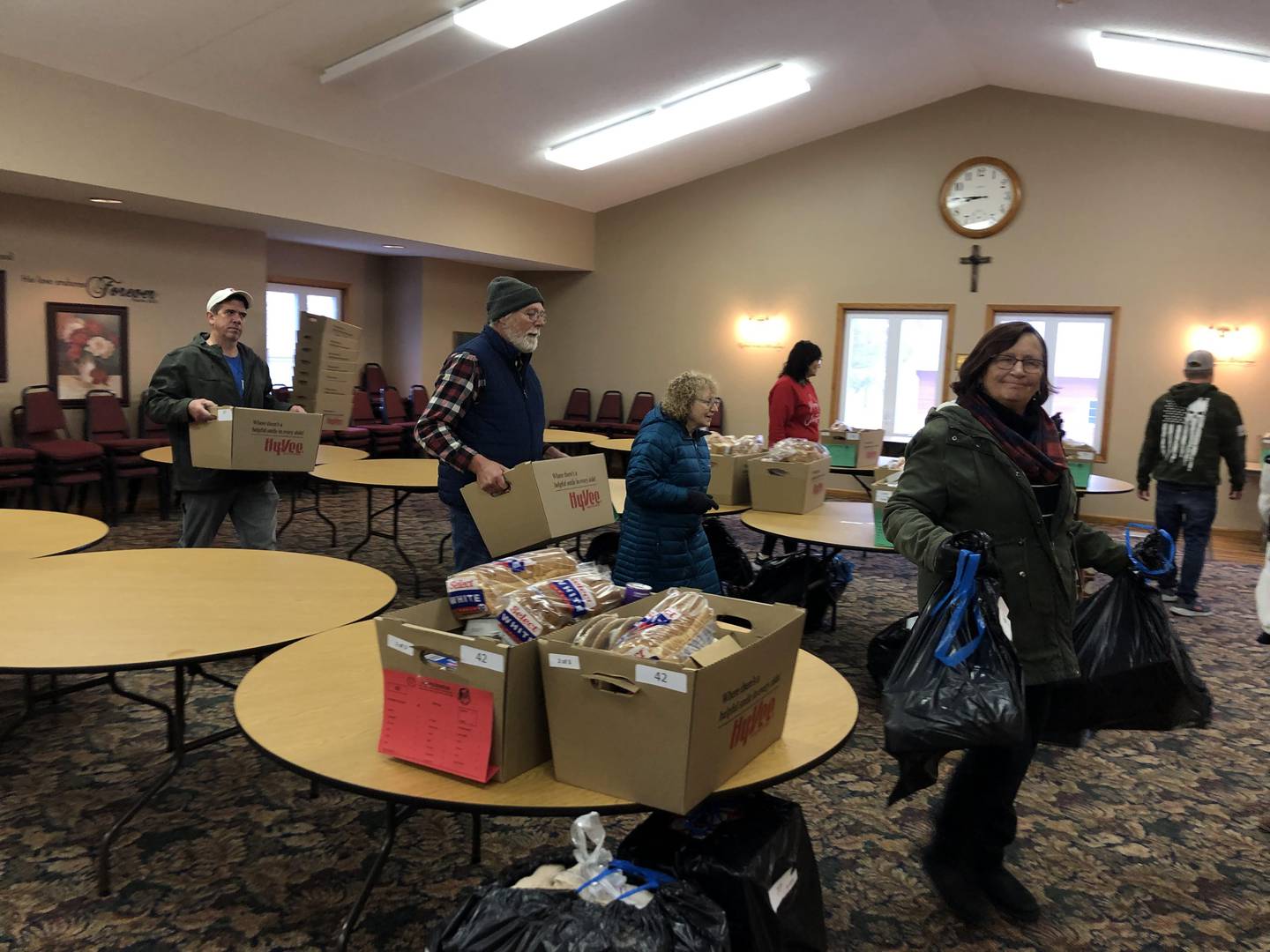 Volunteers help the Putnam County food pantry distribute Christmas baskets to families at the United Church of Christ in Granville on Saturday, Dec 17, 2022.