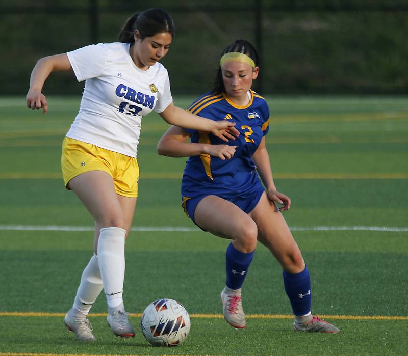 Cristo Rey St. Martin's Josselin Gallegos tries to control the ball in front of Johnsburg's Devynn Michel during an IHSA Class 1A Cristo Rey St. Martin Sectional semifinal girls soccer match on Tuesday, May 26, 2026 at Cristo Rey St. Martin College Prep, in Waukegan.