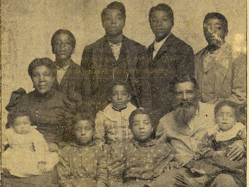 Judy and Henry Beard are seated around their nine children in this DeKalb County History Center archive photo.