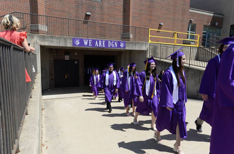 Downers Grove North graduates walk to their seats during the graduation ceremony held Sunday May 21, 2023.