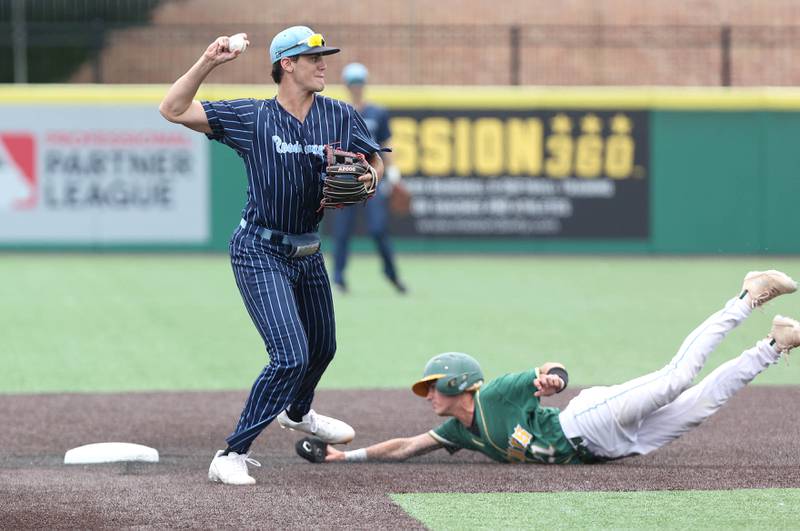Nazareth's David Cox tries to turn a double play as Crystal Lake South's Dayton Murphy slides in hard to break it up Friday, June 10, 2022, during their IHSA Class 3A state semifinal game at Duly Health and Care Field in Joliet.