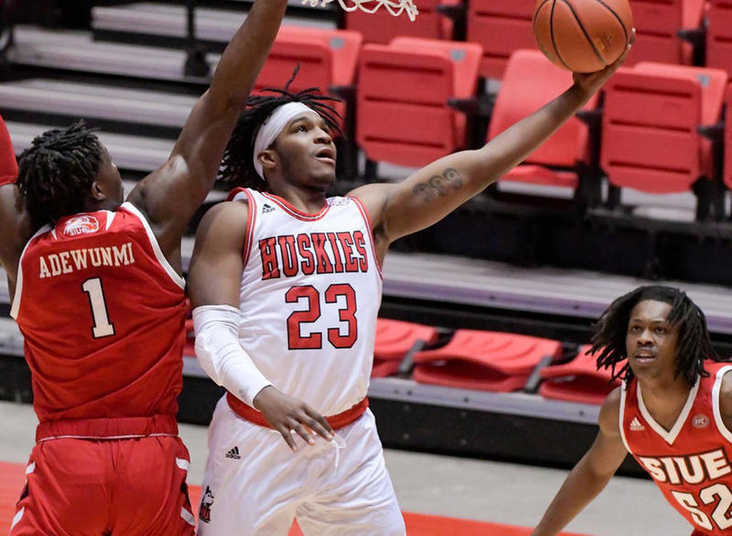 NIU’s Tyler Cochran (23) lays up for a shot after getting past SIUE’s Mike Adewunmi (1) during the first half of play at Northern Illinois University's Convocation Center on Wednesday, Dec. 2, 2020 in DeKalb.