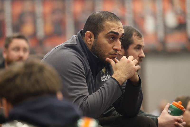 Joliet West head coach Awais Arain watches the SouthWest Prairie Conference 175 pound championship on Saturday, Jan. 24, 2026 in Minooka.