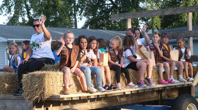Putnam County Girl Scout troop 1623 rides on a float during the inaugural Homecoming parade on Wednesday, Sept. 17, 2025 down Elm Street in Granville.