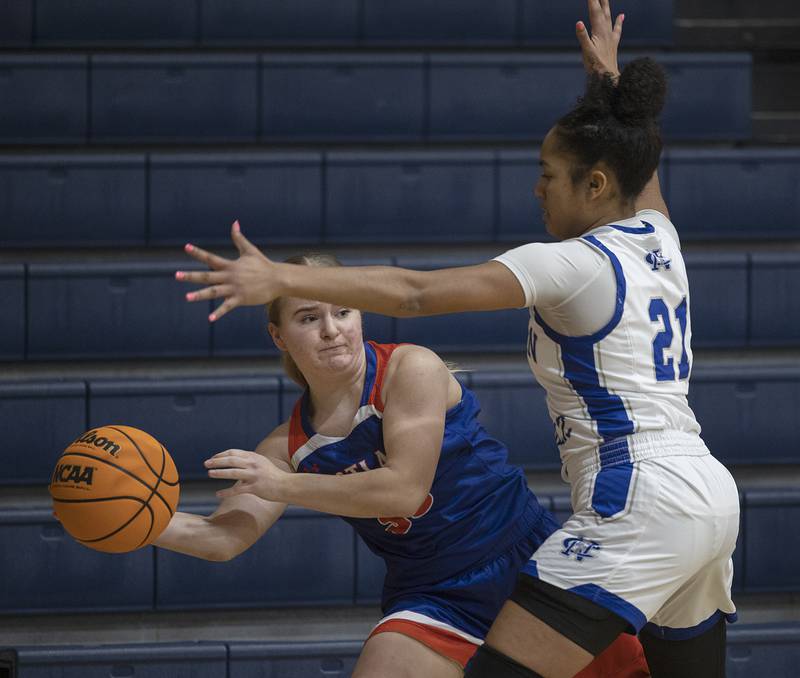 Eastland’s Morgan McCullough makes a pass while being guarded by Newman’s Gisselle Martin Tuesday, Jan. 7, 2025, at Newman High School.