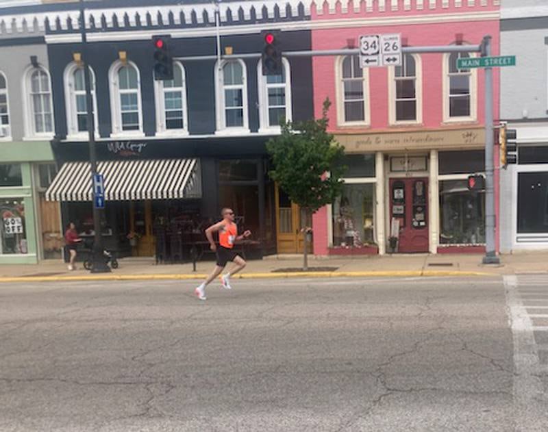 Colin Mickow, 35, of Oswego finishes the Princeton Mile Race Saturday morning.
