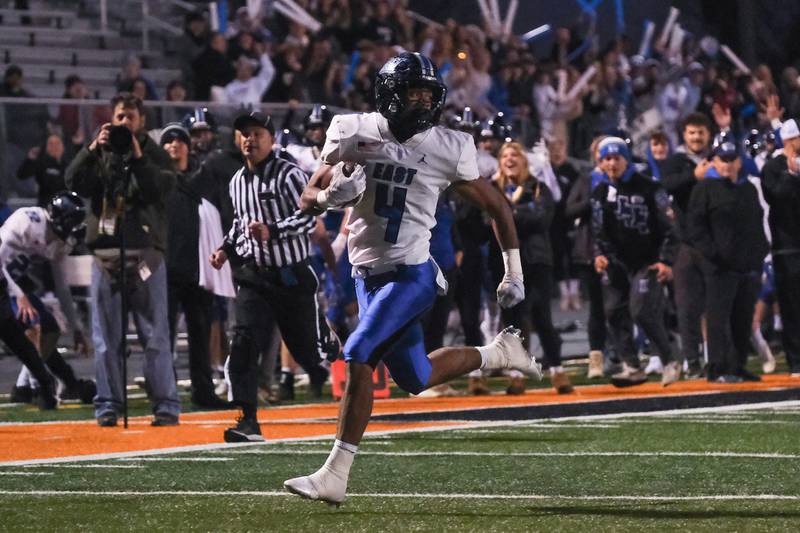 Lincoln-Way East's Trey Johnson finds open field on a touchdown run against Minooka in the Class 8A 2nd round playoffs in Minooka on Saturday, Nov. 6, 2021.