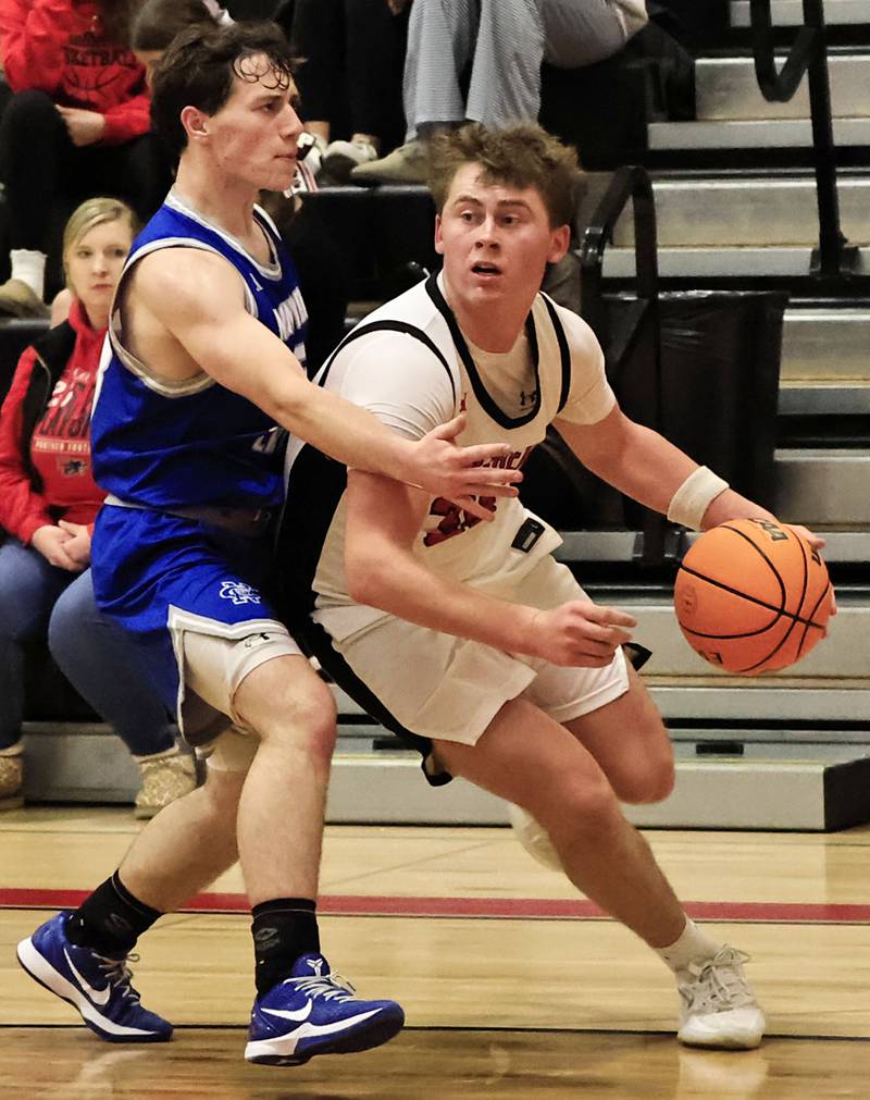 EP Panthers junior Evan Steimle powers past Newman senior Garret Matznick Wednesday, Jan. 28, 2026,  in Prophetstown to add 2 more points to the scoreboard for the Panthers.