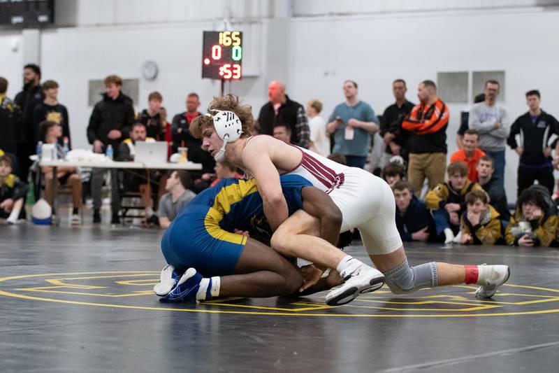 Wheaton Academy's Tyler Jones, top, and Altoff Belville's Pierre Walton wrestle in the 165-pound championship match during the Reed-Custer Comet Classic Wrestling Invite on Saturday, Jan 17.