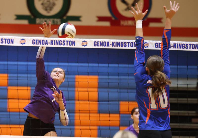 Rochelle's Meredith Bruns spikes the ball by Genoa-Kingston's Bria Botterman during their match Monday, Sept. 15, 2025, at Genoa-Kingston High School.