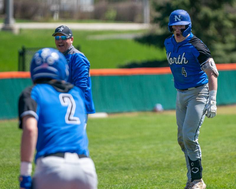 St. Charles North's Jayden Lobliner (4) reacts as he rounds third base after hitting a homer against St. Charles East during a baseball game at St. Charles East High School on Saturday, May 7, 2022.