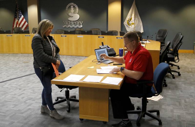 Bobbi Baehne files her paperwork Tuesday, Nov. 12, 2024, to run for Ward 1 alderwomen with McHenry Deputy Clerk Monte Johnson during first day of filing for the consolidated election on April 1, 2025.