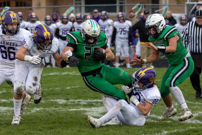 Dwight/Gardner-South Wilmington running back Ayden Collom (25) gets tripped up by the Farmington defense Saturday, Nov. 16, 2024, during a Class 2A quarterfinal in Dwight.