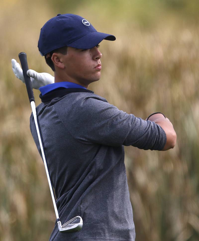 Woodstock Co-op’s Brady Yergons reacts to his tee shot on the sixth hole during the IHSA Class 3A Jacobs Sectional golf tournament on Monday, Oct. 7, 2024, at Randall Oaks Golf Club in West Dundee.
