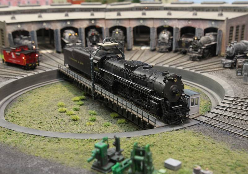 A steam locomotive pulls out of a Round House at the Lake County Model Railroad Club in Wauconda. The club is celebrating their 50th anniversary.