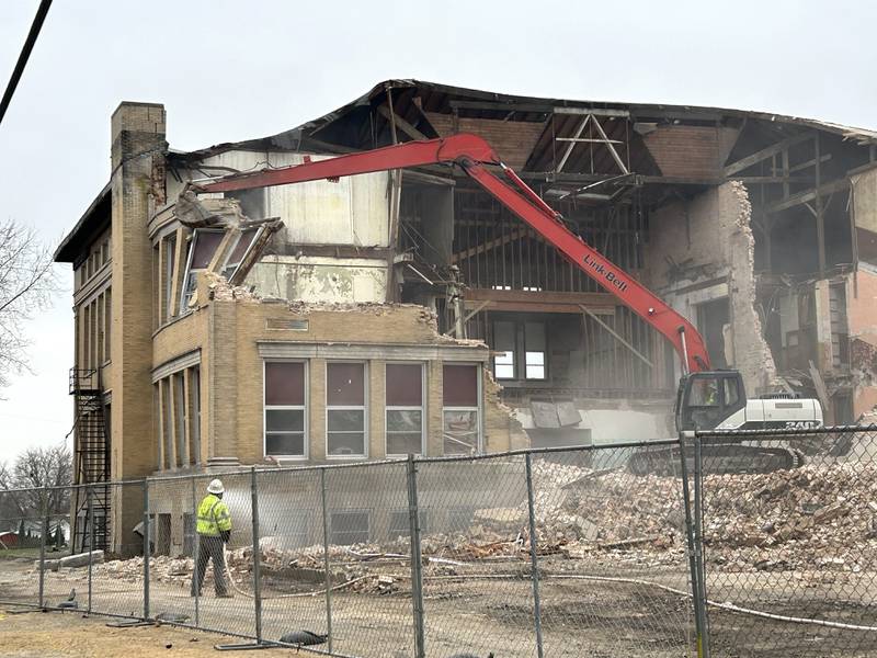 Workers from Fischer Excavating of Freeport demolish a portion of the east wall of the Congress School, 208 N. Congress Ave., on Tuesday, April 1, 2025 in Polo. Demolition of the 41,000-square-foot school built in 1899 is expected to continue this week.