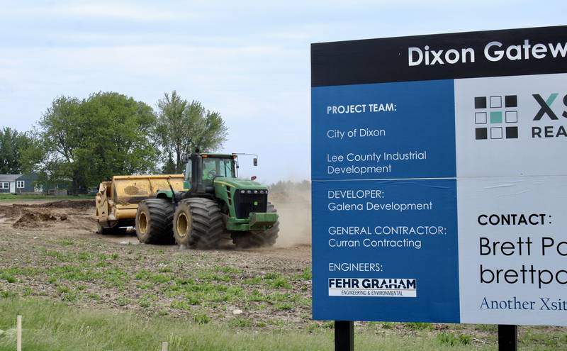 A tractor pulling a grade-leveling scraper moves across the property that is part of the Dixon Gateway Development along Illinois Route 26 and Keul Road on the south end of Dixon. The groundbreaking for the project was April 28.