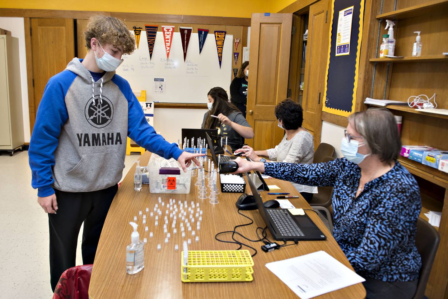 Sophomore Brayden Cole has his SHIELD Illinois saliva sample scanned before heading back to class. From start to finish the testing took less than five minutes. Results will be provided by the end of the day. This is part of the contact tracing procedures that take place at Sterling High School.