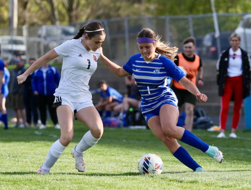 It's a 1 on 1 battle as Princeton's Olivia Sandoval attack's L-P's Addie Dawson Tuesday night at Bryant Field. The Cavs won 6-1.