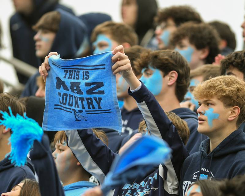 A Nazareth academy fan cheers during the game on Saturday Nov. 22, 2025, during the 6A semifinals game while taking on Fenwick held at Nazareth Academy High School in La Grange Park.