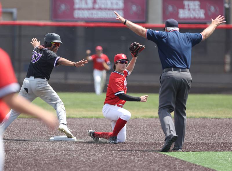 Downers Grove North's Noah Battle (17) slides safely into second during the IHSA Class 4A baseball regional final between Downers Grove North and Hinsdale Central at Bolingbrook High School on Saturday, May 27, 2023.