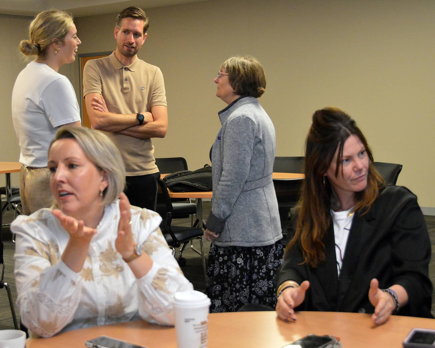 Maud Slutter and Wilbert Smeets talk to Tutoring and Writing Center Coordinator Angela Dunlap (background) while Karin van Zelst and Manon van de Rijdt (foreground) visit with IVCC instructors during a welcome reception when the Dutch educators first arrived. Their hosts – Amanda Cook Fesperman, Tina Hardy and Jill Urban-Bollis – will travel to The Netherlands next spring to experience the Dutch college system.