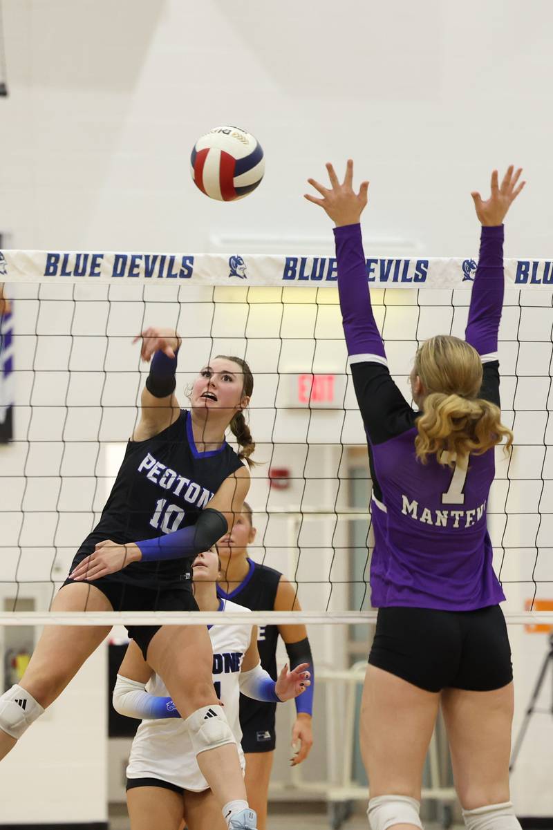 Peotone's Alexa Matichak hits under pressure from Manteno's Leah Milton during the Blue Devils' loss in three sets, 19-25, 25-19, 25-21, to Manteno on Tuesday, Sept. 23, 2025.