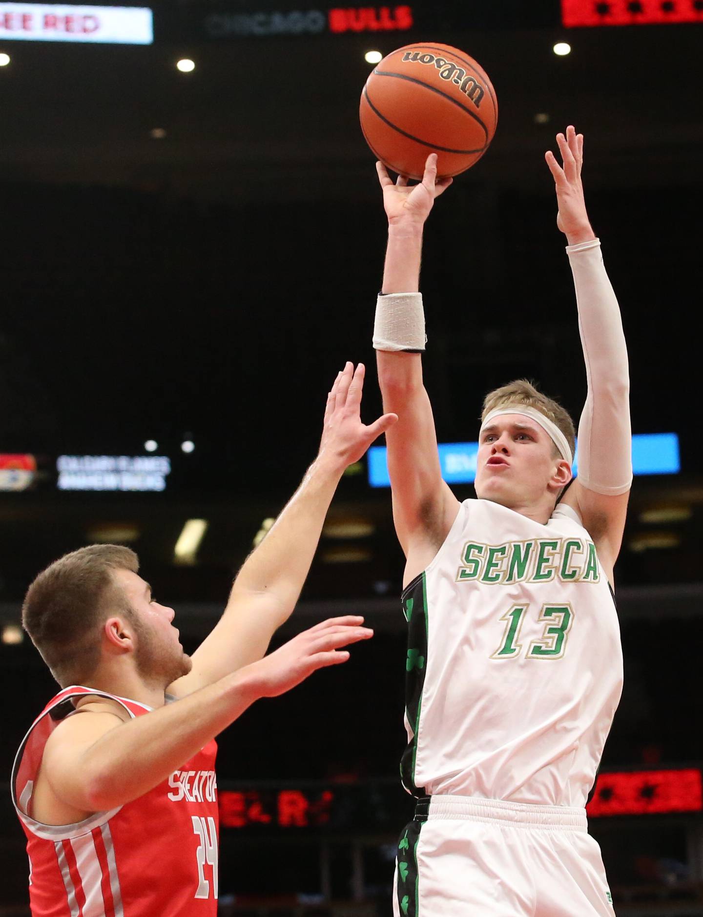 Seneca's Paxton Giertz shoots a jump shot over Streator's Landon Muntz during a game on Tuesday, Dec. 21, 2023 at the United Center in Chicago.