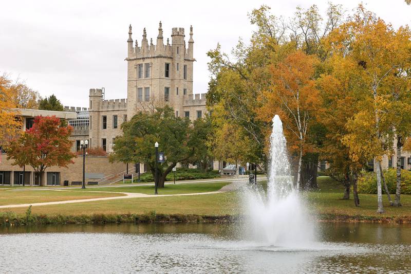 Colorful trees surround Altgeld Hall and the East Lagoon Monday, Oct. 17, 2022, on the campus of Northern Illinois University in DeKalb.