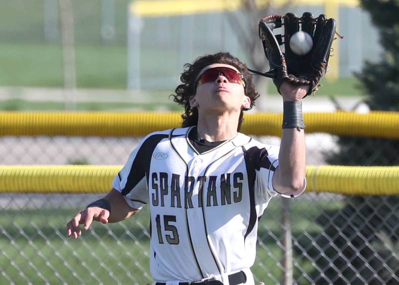 Sycamore's Will Klumpp hauls in a fly ball in left field during their game against Ottawa Friday, April 19, 2024, at the Sycamore Community Sports Complex.