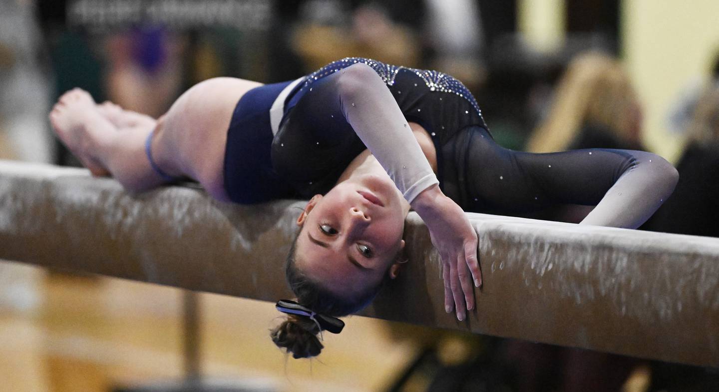 St. Charles Coop’s Abby Werner competes on balance beam during the Fremd gymnastics regional on Thursday, Feb. 5, 2026 in Palatine.