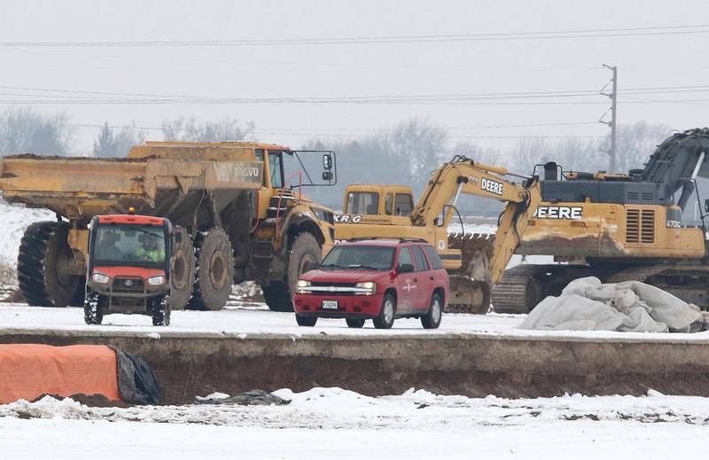 Construction crews continue work Friday at the ChicagoWest Business Center in DeKalb. Ferrara Candy Company has announced plans to build at the site.