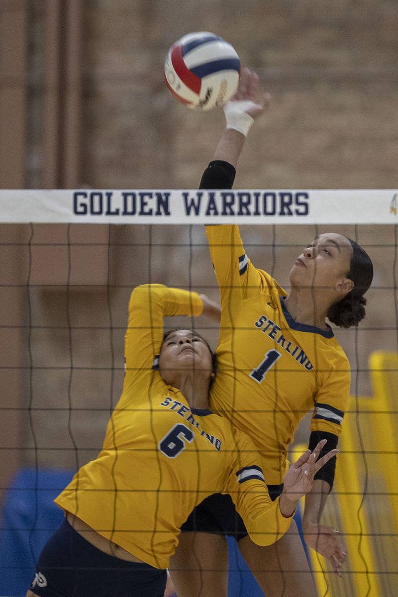 Sterling’s Nia Harris (right) and Alasia Harris Rascon come together on a play against Geneseo Tuesday, Sept. 30, 2025.