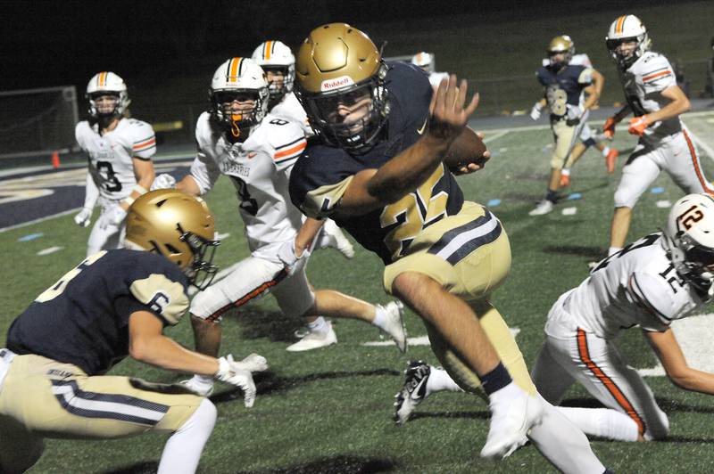 Lemont runningback Sam Andreotti (25) weaves his way past the St. Charles East defense, getting the ball to the one yard line during a varsity football game at Lemont High School on Friday.