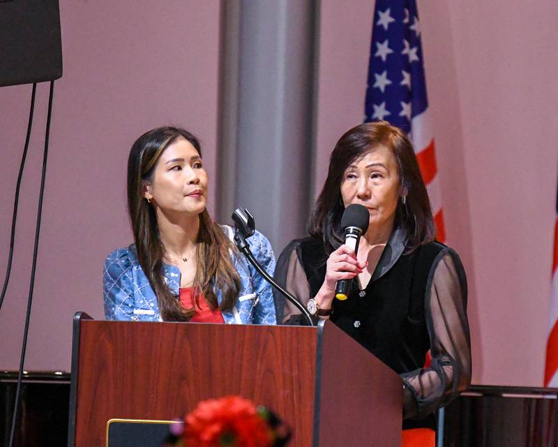 Dora Chang, left, and Claire Wu welcome everyone to the Taiwanese American Chamber of Commerce Greater Chicago before the performance of the Jhong Jheng Elementary School Suona and Drum Ensemble from Kinmen, Taiwan on Saturday April 19, 2025, held at the Taiwanese American Chamber of Commerce building in Westmont.