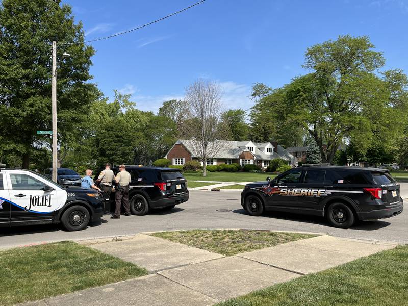 Joliet police officers and Will County sheriff's deputies at the intersection of Caton Avenue and Midland Avenue on Tuesday, May 30, 2023.