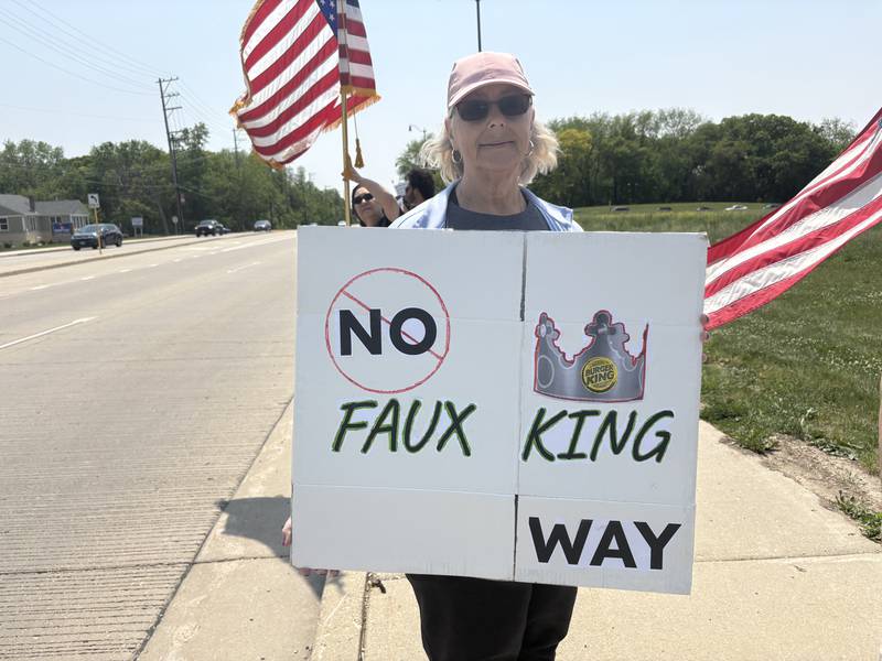 A protestor holds up a sign during a rally against President Donald Trump in Huntley May 31, 2025.