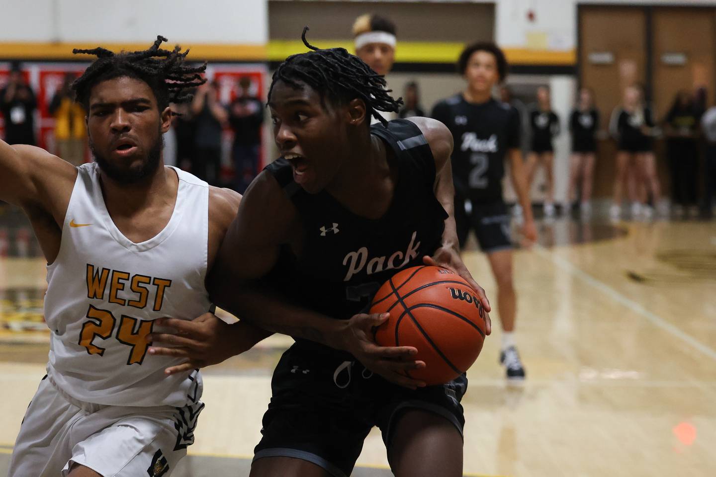 Oswego East’s Mekhi Lowery looks to make a play against Joliet West.