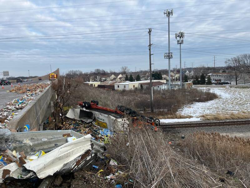 On Sunday morning, a semi driving carrying chicken broth and disinfectant wipes and driving northbound on Interstate 55 near Route 30 rolled off Interstate 55 and onto the train tracks below Interstate 55.