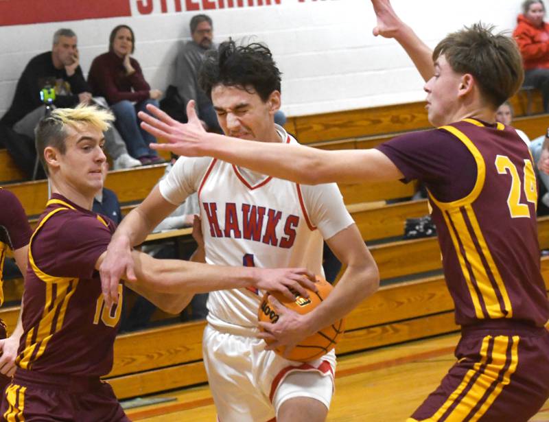 Oregon's Benny Olalde (1) draws contact from Stockton defenders as he drives to the basket at the 64th Annual Forreston Holiday Basketball Tournament held at Forreston High School on Saturday, Dec. 13, 2025.