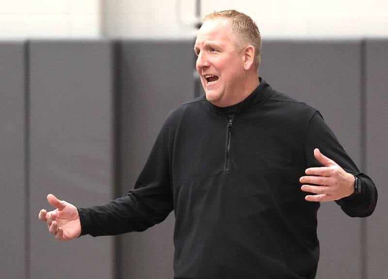 DeKalb head coach Mike Reynolds talks to an official Monday, Jan. 15, 2023, during their game against Lyons Township in the Burlington Central Martin Luther King Jr. boys basketball tournament.