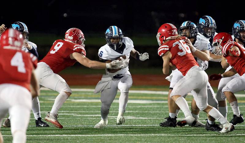 Downers Grove South's Deon Davis (6) moves upfield Friday October 27, 2023 in Naperville.